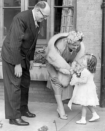 The Queen Mother visiting the Guinness Trust sheltered housing estate, Plaistow Road. 21 June 1955.