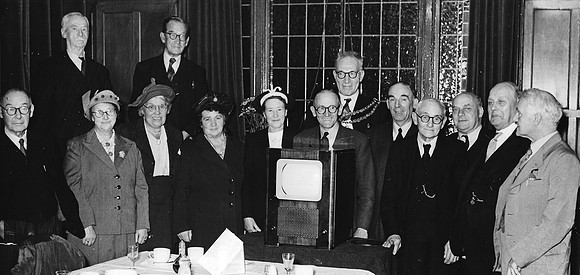 Alderman William Gillman, Mayor of West Ham (1953-54), and former mayors at the retirement presentation to George Ware, Mayor's Chauffeur