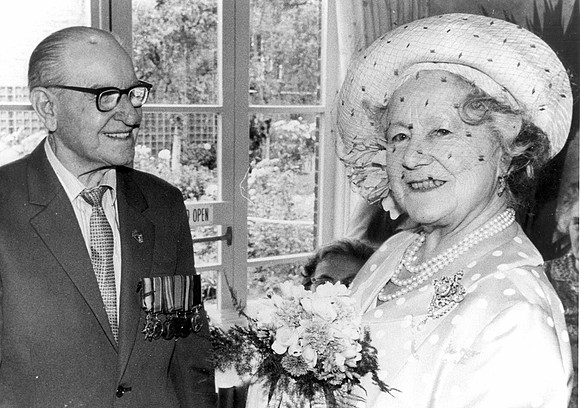 The Queen Mother with Mr M F Outten during a visit to Stondon House, Guinness Trust, Plaistow Road. 28 June 1984.