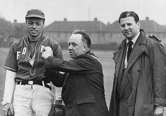 Baseball in West Ham. Mayor William Paton pitches the ball. 1952.