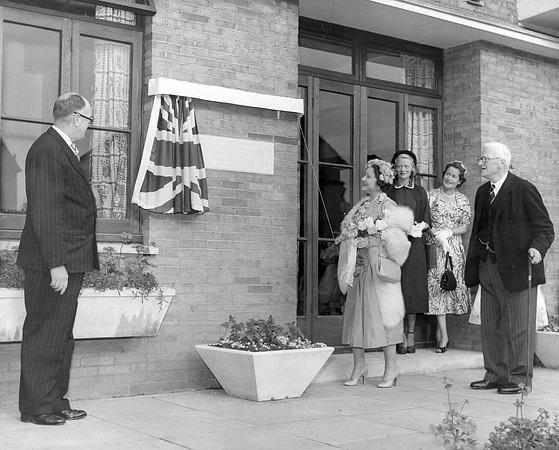 The Queen Mother visiting the Guinness Trust sheltered housing estate, Plaistow Road. 21 June 1955.