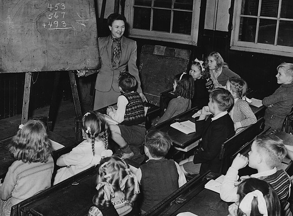 Miss Wilkey of Long Beach, California, teaching at West Ham Church School during an exchange visit.