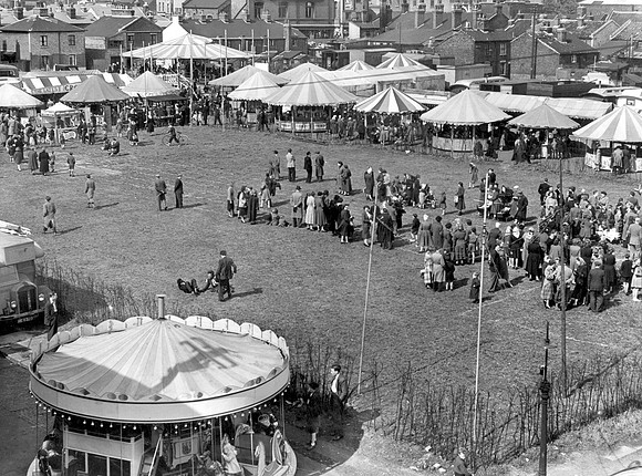 Fair on bombed sites of Cullum, Broad & Earl Streets, Stratford. 16 May 1953.