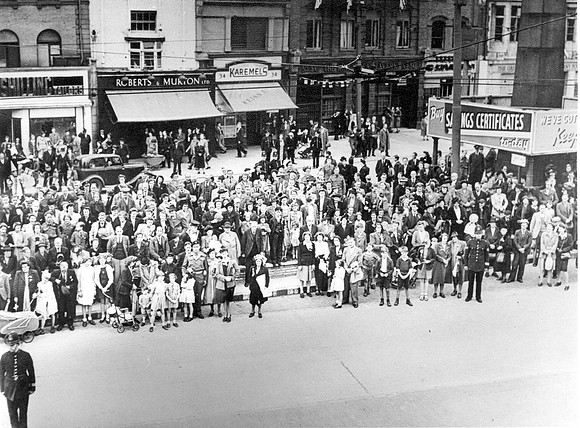 VE Day. 8 May 1945. Crowd below West Ham Town Hall balcony.