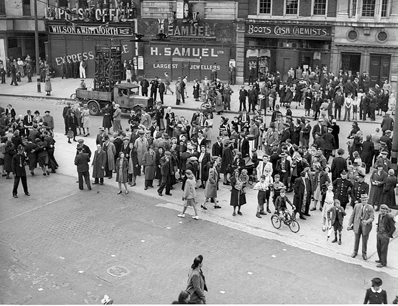 VE Day. 8 May 1945. Crowd below West Ham Town Hall balcony.