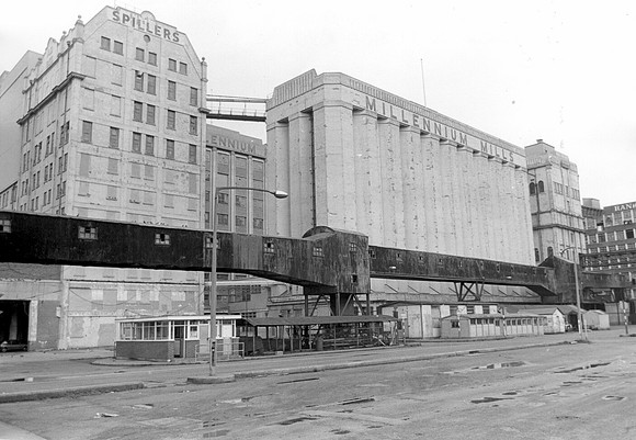 South facade. Spillers Millennium Mills, from Mill road. Entrance, south side, Royal Victoria Dock. 30 March 1984.