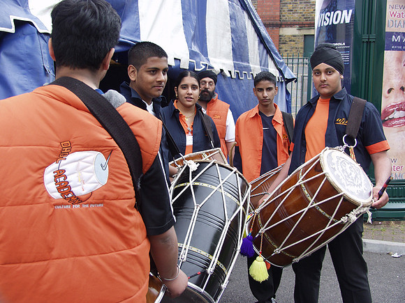 Dhol Academy musicians await the Queen's Golden Jubilee visit, 2002.