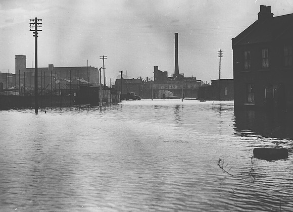 1953 Floods. Forty Acre Lane, Canning Town, looking towards Lamson Paragon and the Canning Town Glass Works