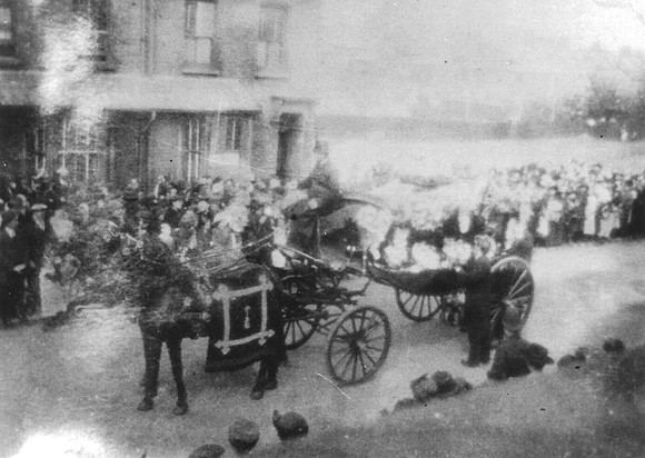 Ladysmith Road, Canning Town. Funeral of Leo Grogan following an air raid. May 1918